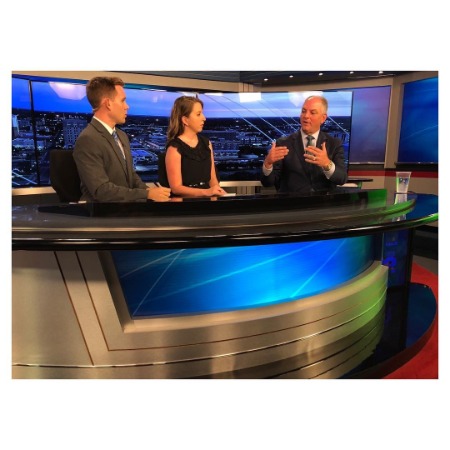 In the middle of the image, Brooke Buford discusses a new book published by Bob Woodward with Guest. On the right of the image, John Kennedy and Her Office mate Steven Maxwell are on the image's left side.